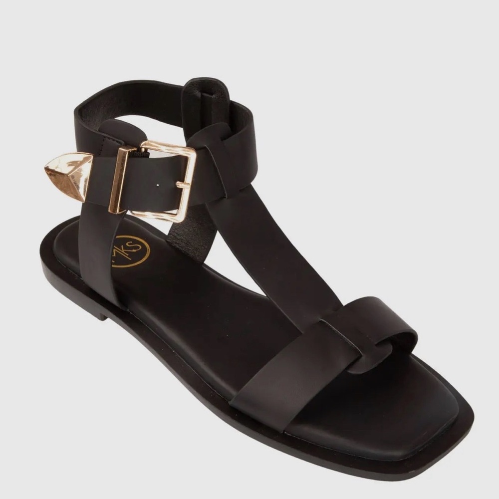 Women’s Black Ankle-Strap Flat Sandals with Gold Buckle